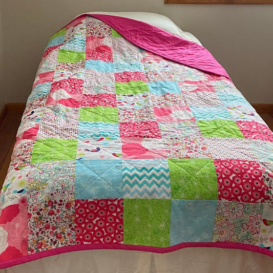 Pink patchwork twin bed size quilt